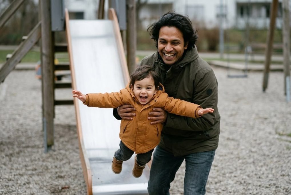 Father joyfully swinging his laughing child at the playground – AI ad image for family and leisure brands.